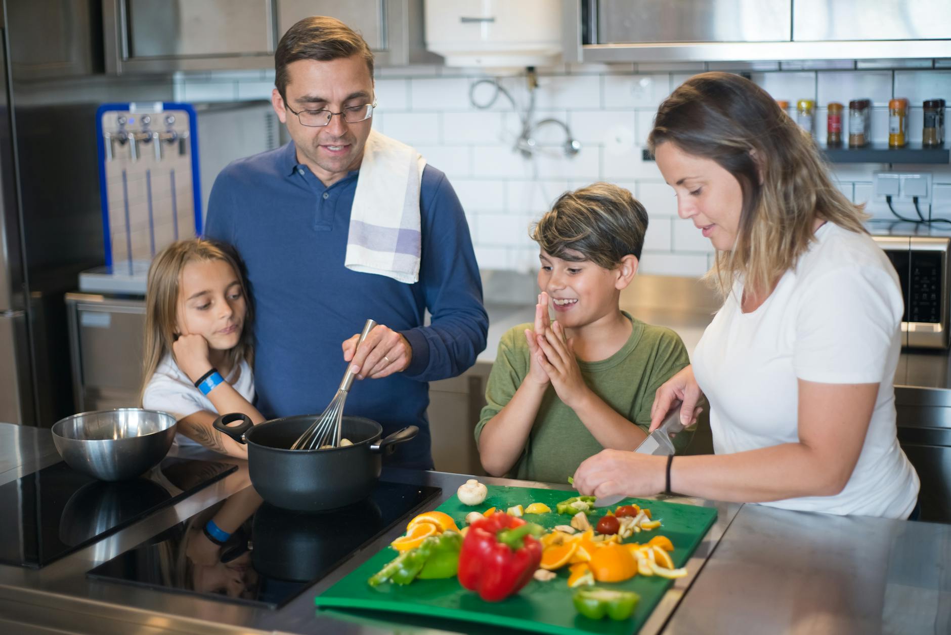 A family cooking together in the kitchen